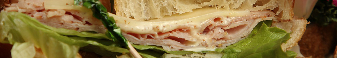 Eating Sandwich Cafe at Cafe Carolina and Bakery restaurant in Raleigh, NC.